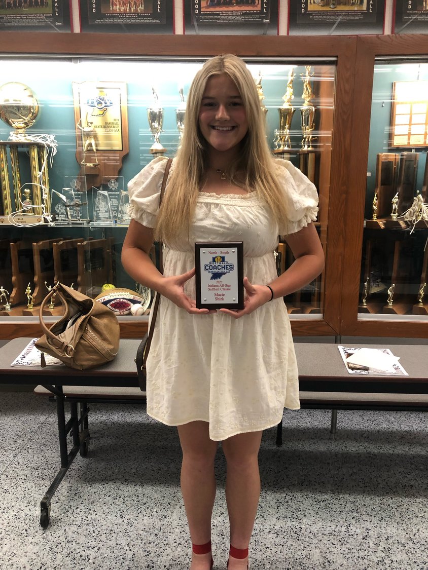 Shirk is pictured holding her plaque at the North/South All-Star banquet.